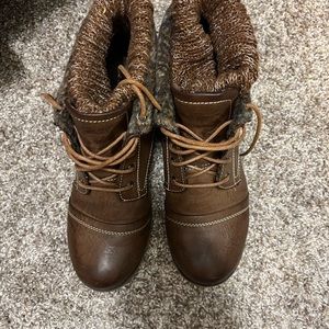 Small boots with sweater top linings button on sides for flaps